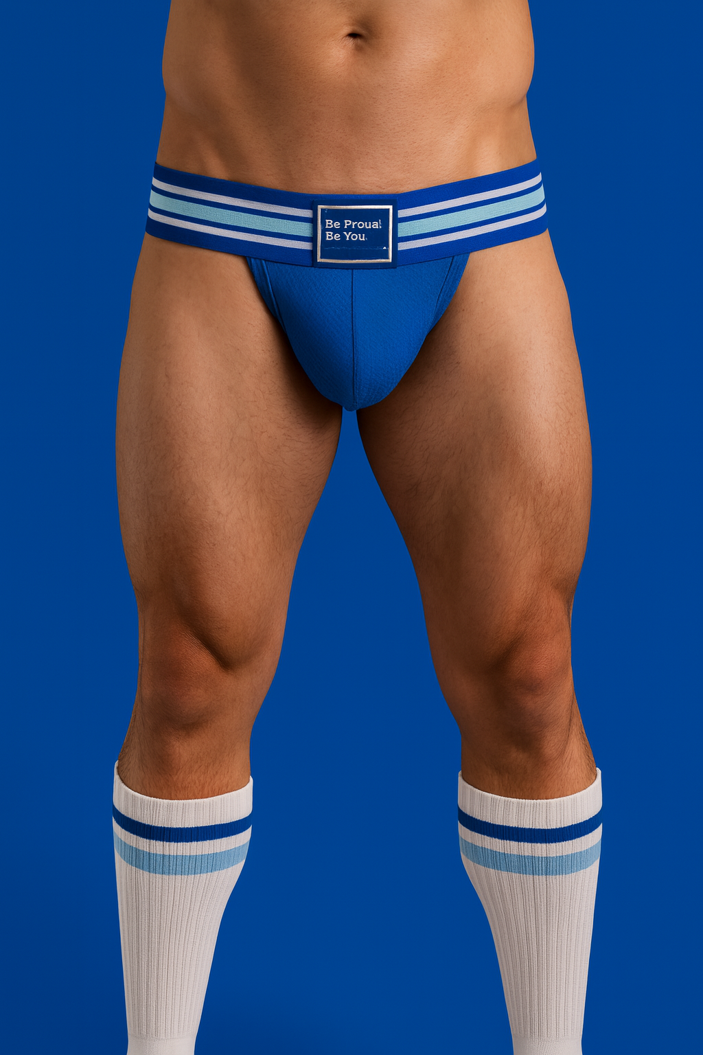 Blue jockstrap with wide waistband wearing white crew socks with blue background