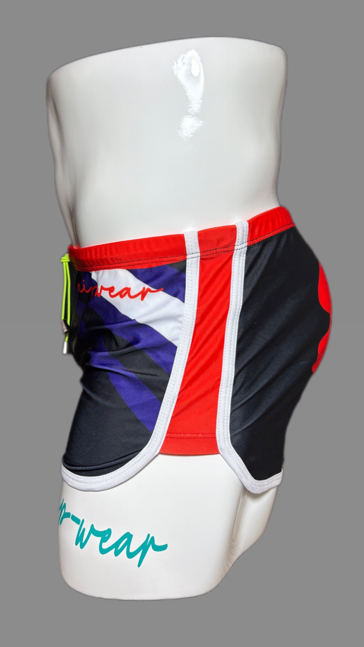 Pup Pride swimwear black blue and red with paw prints by Onip-wear.