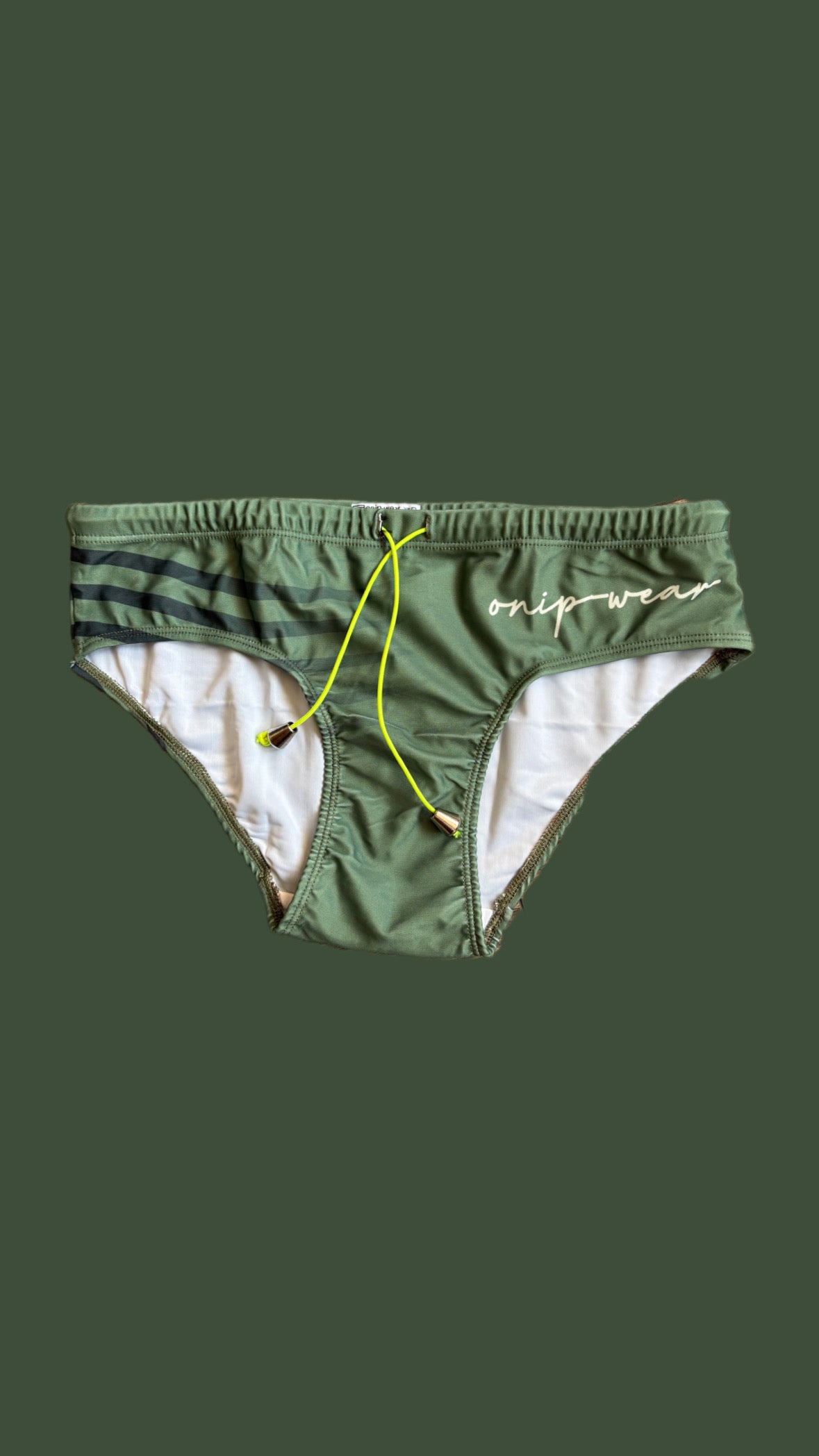 Green swim briefs with a yellow drawstring on a green background