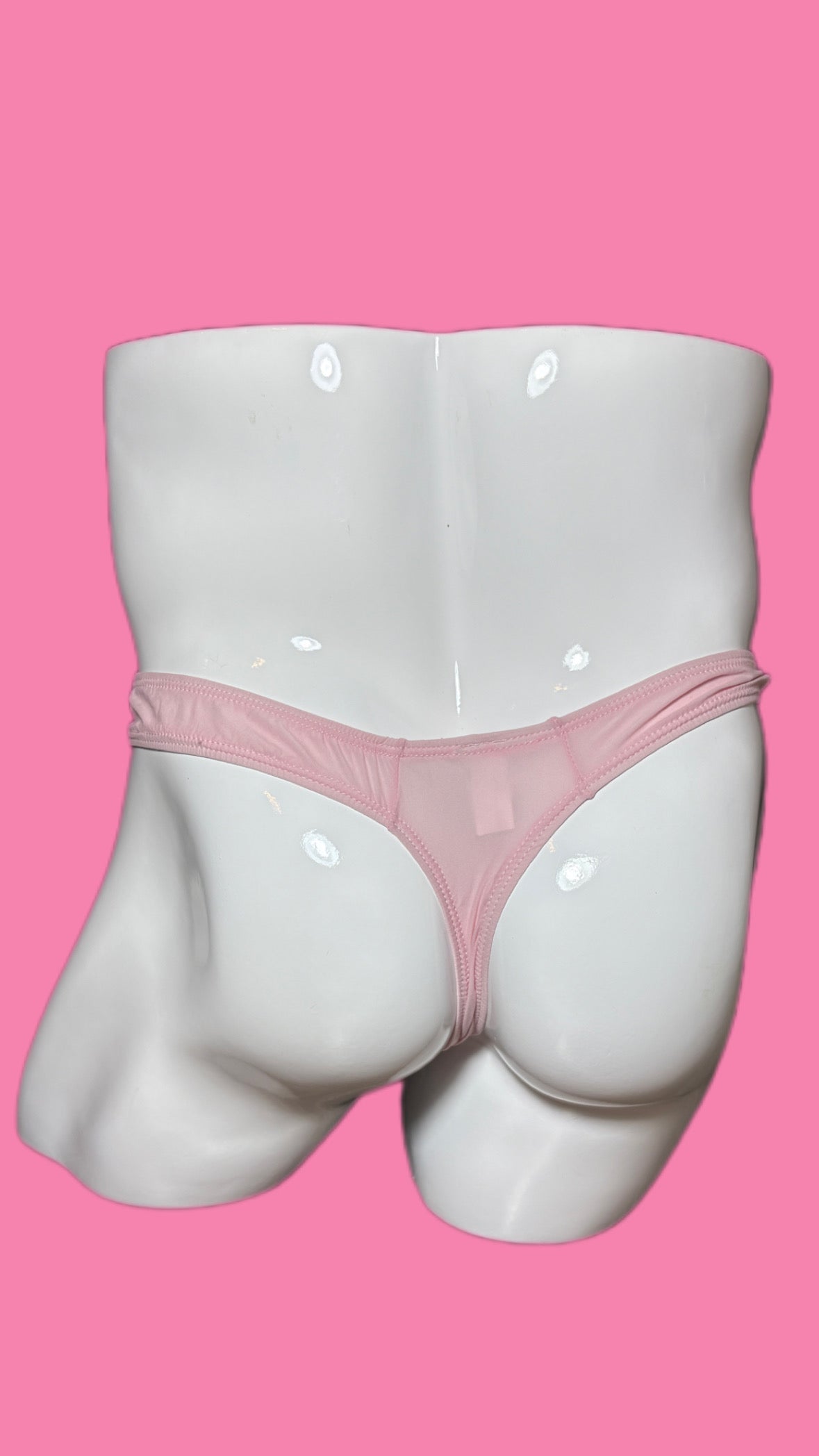 Mannequin wearing pink underwear on a pink background