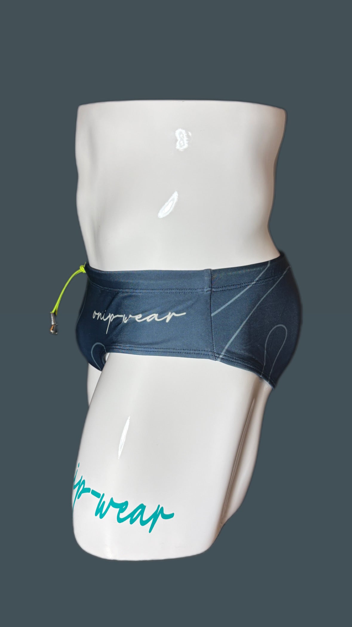 Mannequin wearing grey swimwear on a gray background