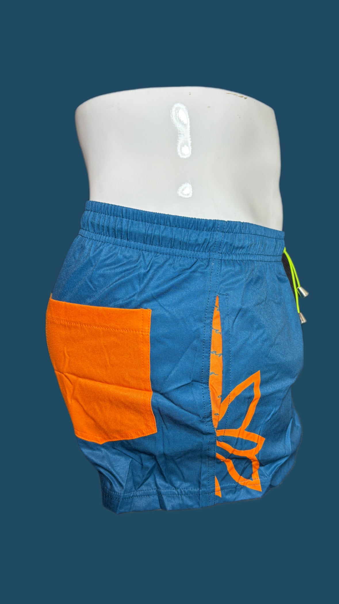 Deep teal with orange swim shorts with pockets and inner liner by onip-wear