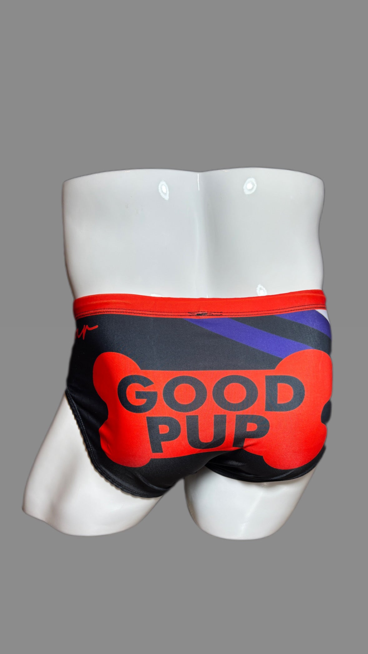 Pup Pride swimwear black blue and red with paw prints by Onip-wear.