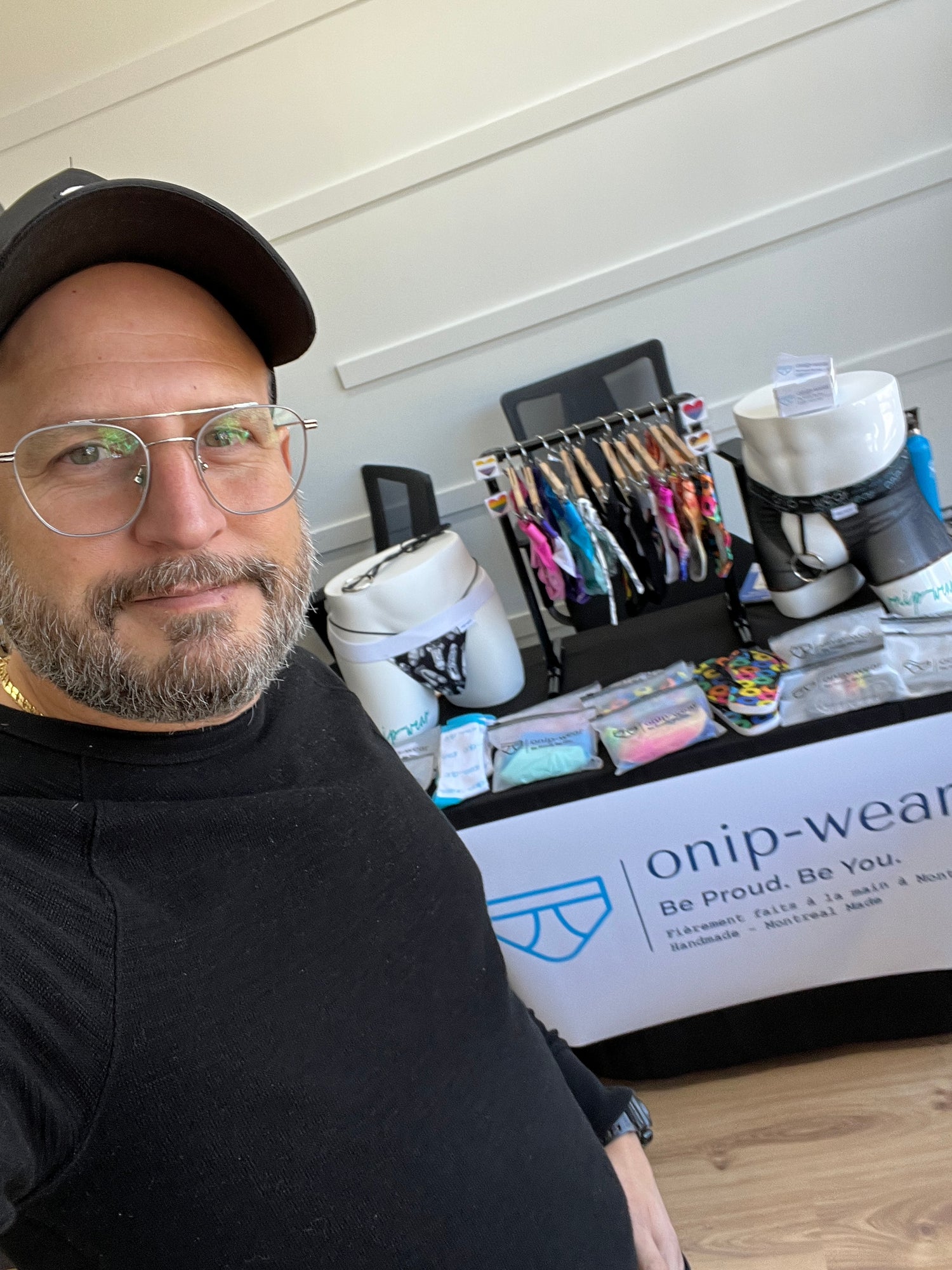 man standing in front of display table