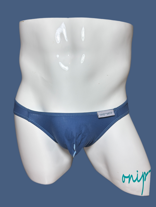 Blue men's underwear on a white mannequin against a blue background