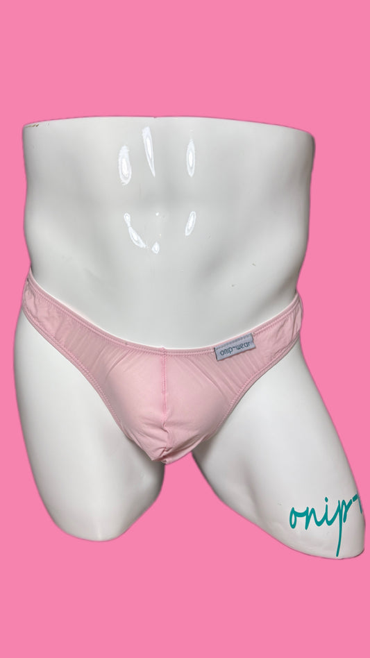 Pink underwear on a white mannequin against a pink background
