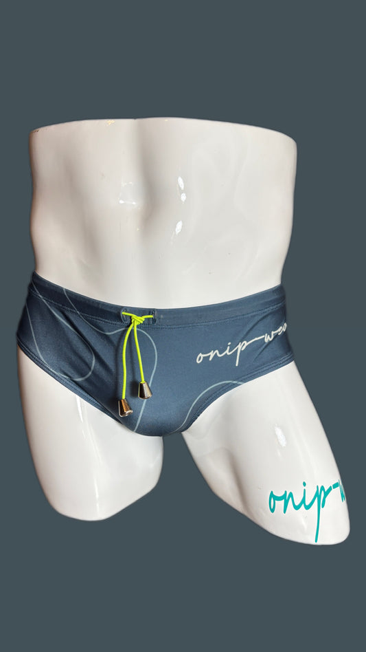 Mannequin wearing blue swim shorts with 'onip' branding on a gray background