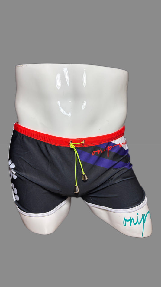 Pup Pride swimwear black blue and red with paw prints by Onip-wear. 