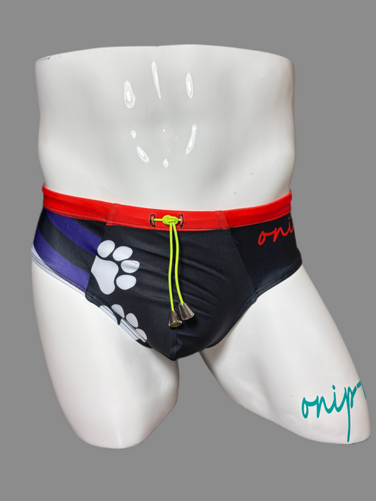 Pup Pride swimwear black blue and red with paw prints by Onip-wear. 