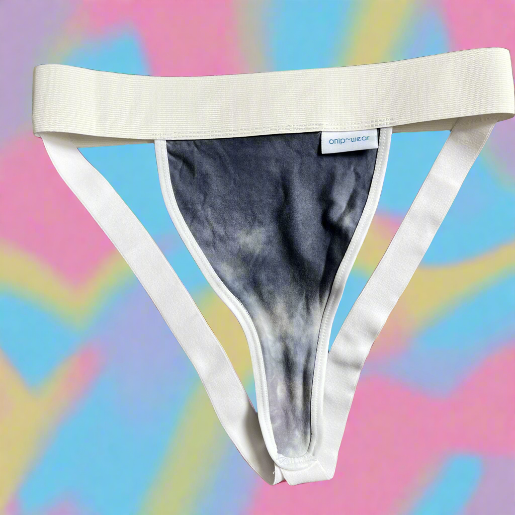 A flat front jockstrap underwear with tie-dye pattern, predominantly gray, trans masc