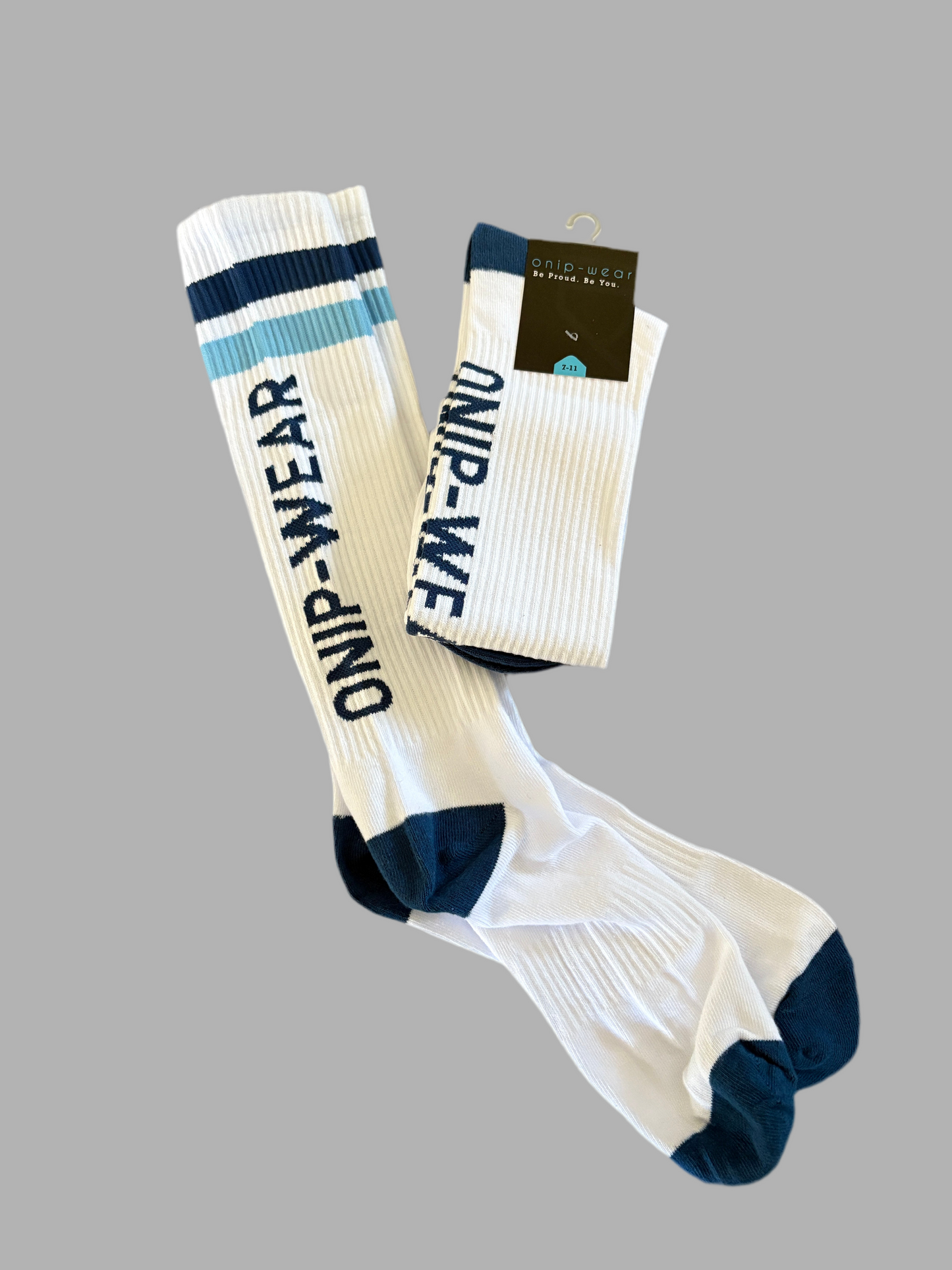 Pair of socks with 'ONIP WEAR' branding on a gray background