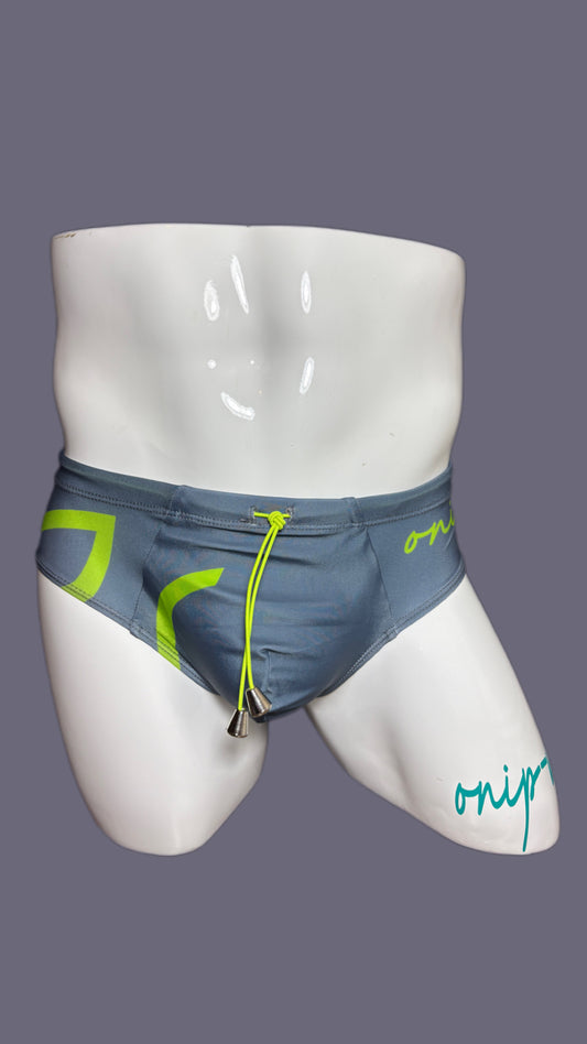 Gray swim briefs with green accents on a mannequin against a gray background